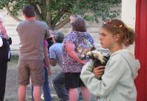 Girl Holds Her Competition Chicken at the Fair